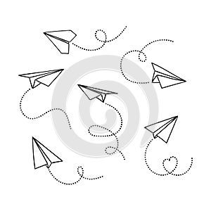 Vector set of hand drawn doodle paper airplane isolated on white background. Line icon symbol of travel